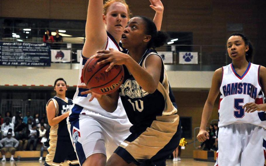 Heidelberg's Chelsea Shivers goes up for a shot as Ramstein's Katherine Enyeart attempts to defend during the Division I championship game Saturday in Wiesbaden, Germany. Heidelberg won the game 32-31.