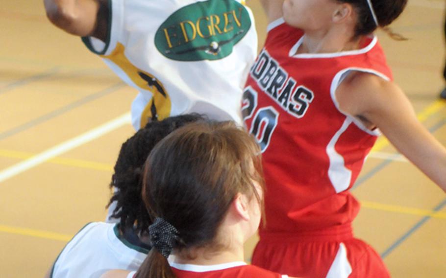 Xala Sledge of Robert D. Edgren shoots against Tara Long (20) of E.J. King during the girls opening game in the 2012 DODDS Japan basketball tournament at Yokota High School. The Eagles beat the Cobras 47-41.