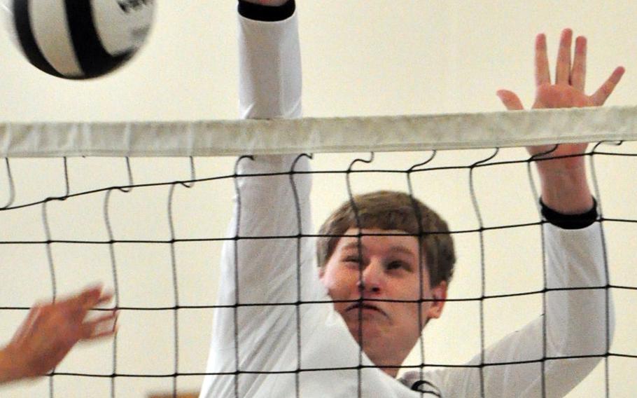 Daegu's Sean Lynch goes up to block the ball against Taejon Christian International during Saturday's Korea boys volleyball match at Camp George, South Korea. The Dragons beat the Warriors 25-16, 25-8, 25-17.