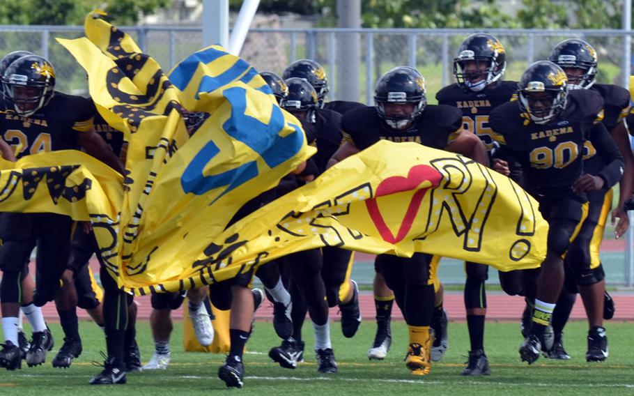 The Kadena football team makes its entrance Saturday before shutting out Seoul American 40-0.