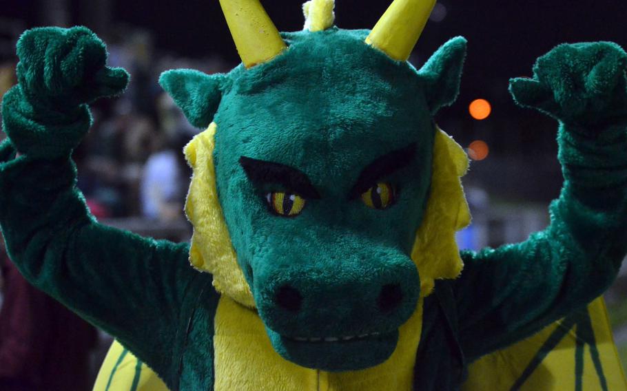 Puff, the Kubasaki mascot, flexes at halftime of Friday's Kadena-Kubasaki game. The Dragons won 28-25.