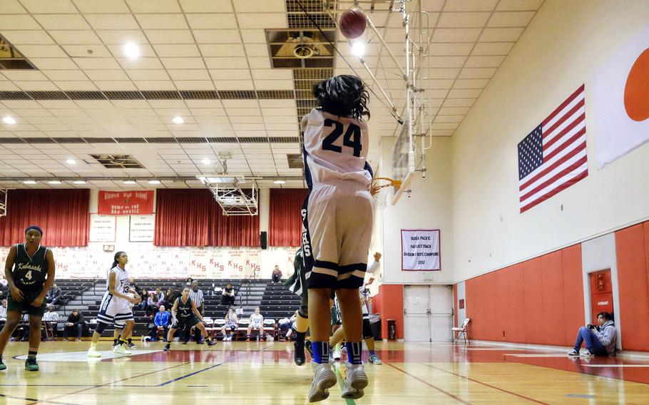 Seoul American's Krista Bradley launches a three-point shot during the girls' basketball Division I Far East Tournament play-in game on Tuesday, Feb. 17, 2015, at Naval Base Yokosuka, Japan. Seoul American's loss means the Falcons finish the season fifth in the Far East standings. 