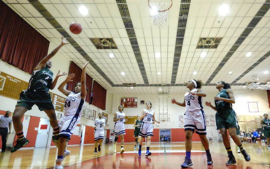 Kubasaki's Taityana Pittman finds a small space to shoot against Seoul American's Krista Bradley during the girls' basketball Division I Far East Tournament play-in game on Tuesday, Feb. 17, 2015, at Naval Base Yokosuka, Japan. Kubasaki's victory earned them the right to play top-seeded Kadena in Wednesday's semifinal.