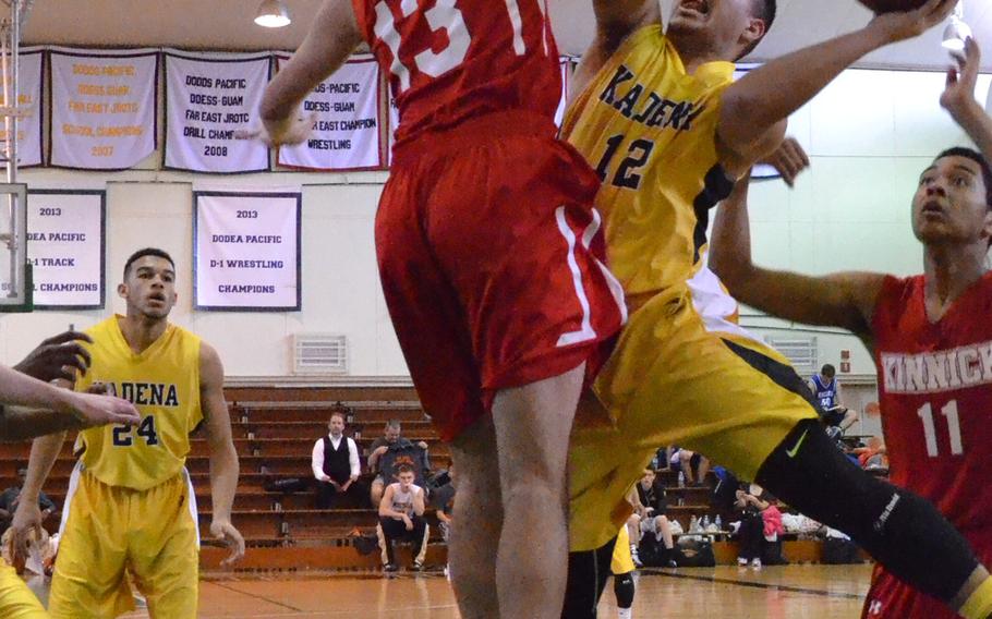 Kadena's Jaret Colon tries to score against Nile C. Kinnick's Xavier Torres.
