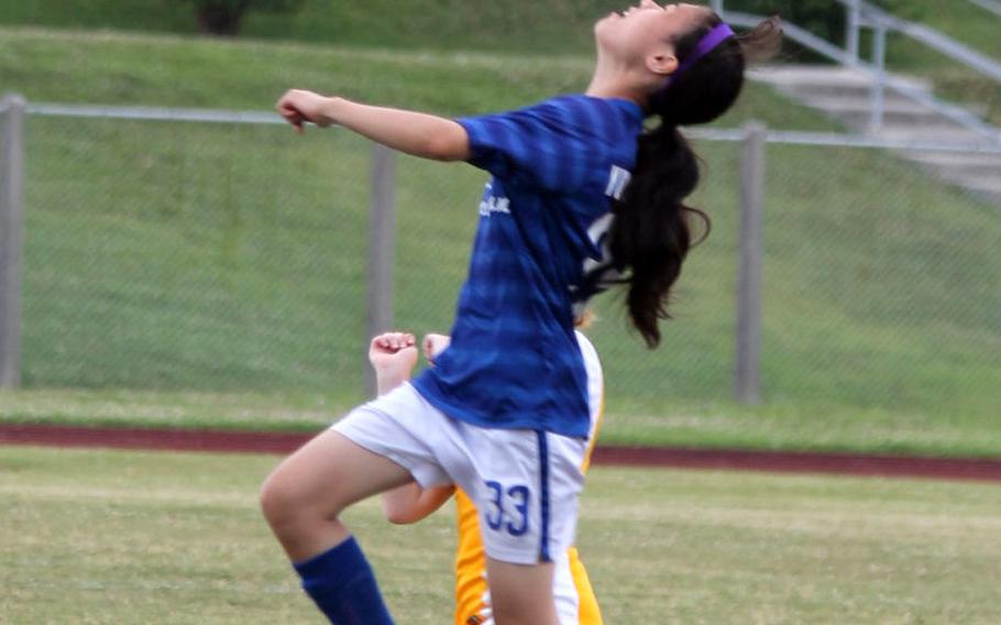 Seoul American's Grace Yuquimpo tries to play the ball off her head during a 1-0 loss to Kadena in girls D-I soccer action.