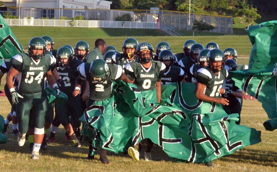 Kubasaki Dragons players make their entrance onto the field before their Okinawa season series-clinching 53-28 home win over reigning Far East Division I champion Kadena.