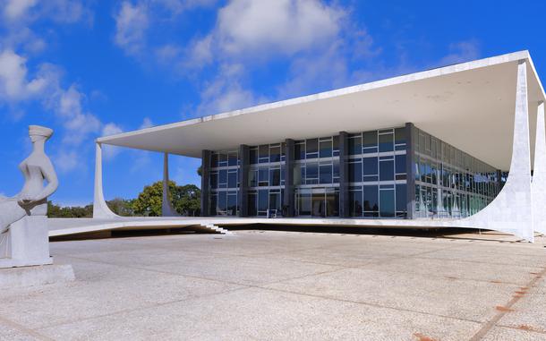 Brazil's Supreme Court, designed by Oscar Niemeyer, and sculpture of Lady Justice by Alfredo Ceschiatti, at Three Powers Plaza in Brasilia, Brazil. 