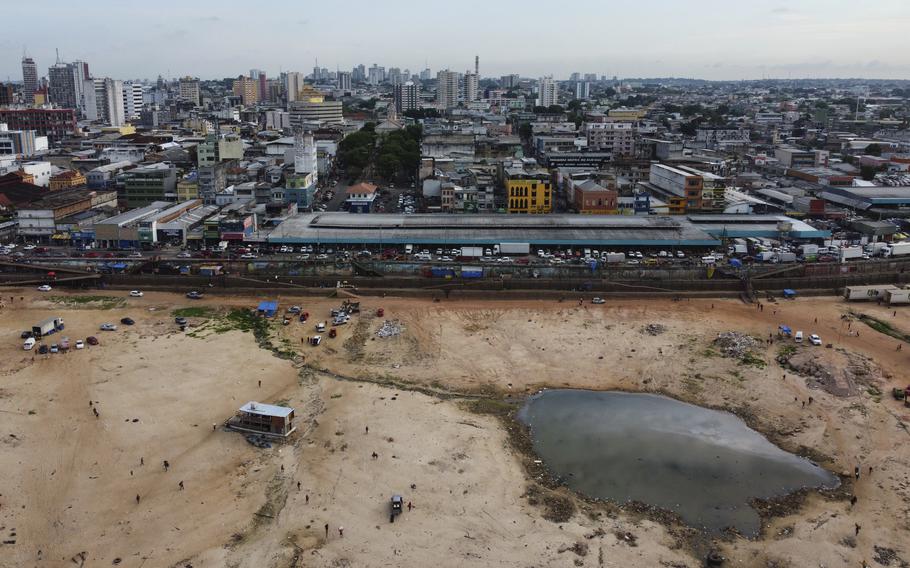 A part of the Negro River is dry at the port in Manaus, Amazonas state, Brazil, Friday, Oct. 4, 2024, amid severe drought. 