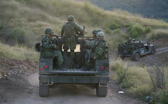 Soldiers patrol near the hamlet Plaza Vieja in the Michoacan state of Mexico, Oct. 28, 2021. The Mexican army acknowledged for the first time on Aug. 2, 2024, that some of its soldiers have been killed by drug cartel bomb-dropping drones in the western state of Michoacan, without providing fatality numbers. 