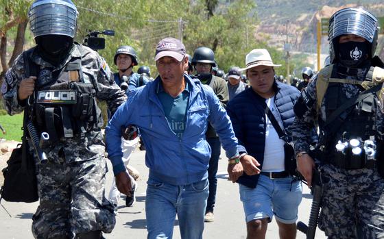 Riot police detain supporters of former Bolivian President Evo Morales during a protest in Parotani, Cochabamba department, Bolivia, on Friday, Nov. 1, 2024. 