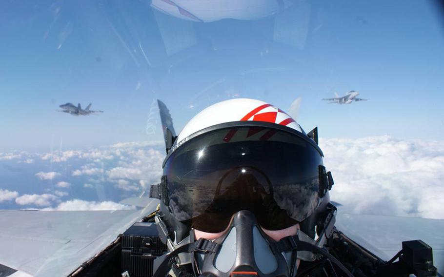 This Thursday, Dec. 20, 2012 photo shows a self portrait of the U.S. navy aviator Lt. j.g. Douglas Spence, 27, of Houston, Texas, on board an F/A18F Super Hornet with the VFA-102, ''Diamondbacks,'' during a training mission in Japan. 