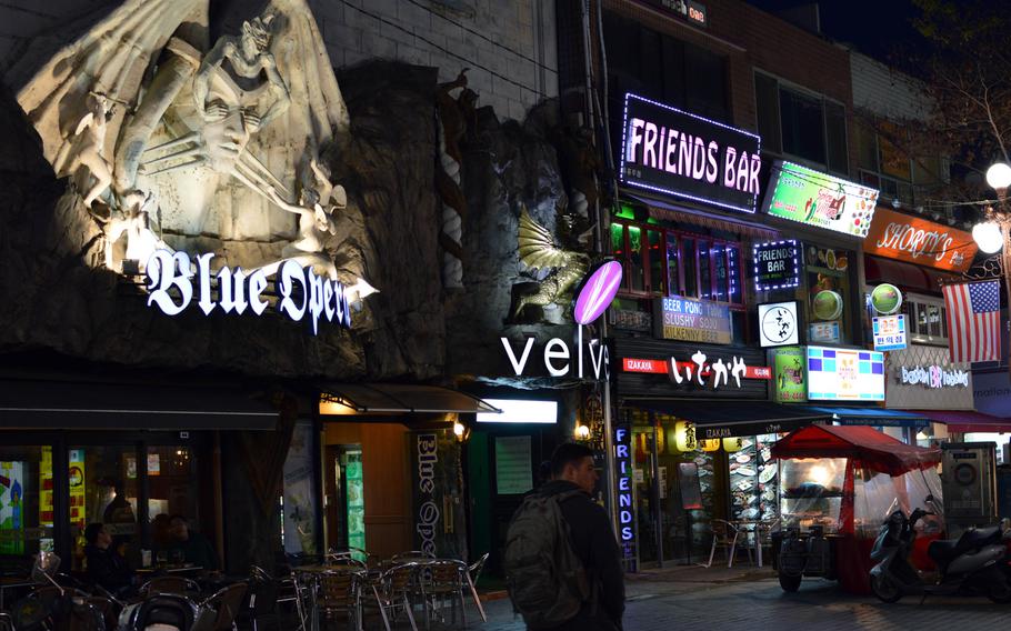 Several bars alongside each other in the Sinjang-dong Shopping Mall outside Osan Air Base, South Korea on April 6, 2014. Bars are commonly found in the basement, first and second floors of many buildings in the area. However, at the insistence of the U.S. military, the juicy bars  that once dotted the landscapes are gone.

