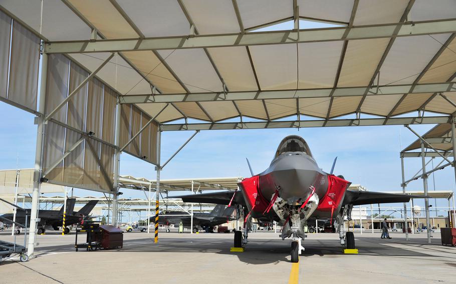 Airmen of the 61st Aircraft Maintenance Unit at Luke Air Force Base, Ariz., work on an F-35 on Dec. 5, 2014.