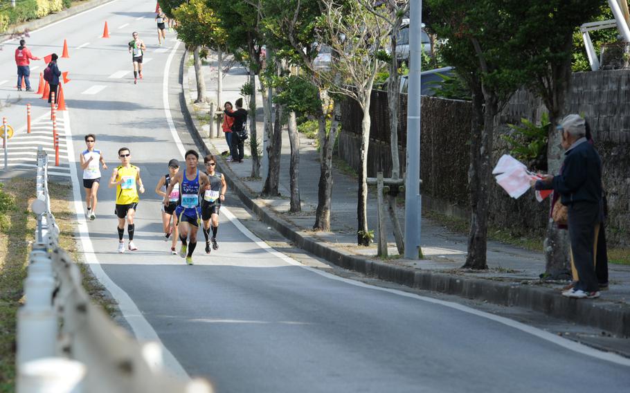 Runners in the 2015 Okinawa Marathon head toward Kadena Air Base, Japan, Feb. 15, 2015. A 1 3/4-mile portion of the 26-mile race went through Kadena from Gate 2 to Gate 5.