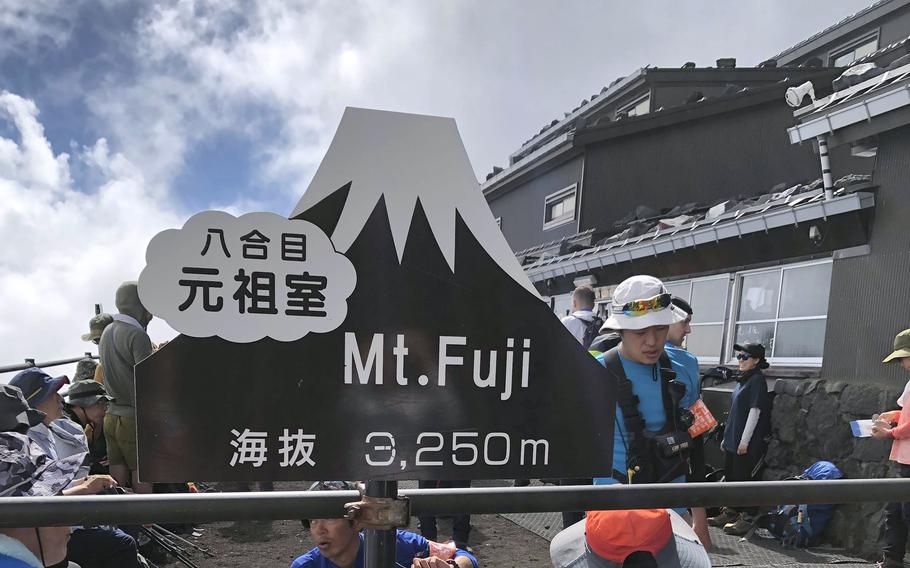 People relax at a rest area on Mt. Fuji in Japan.