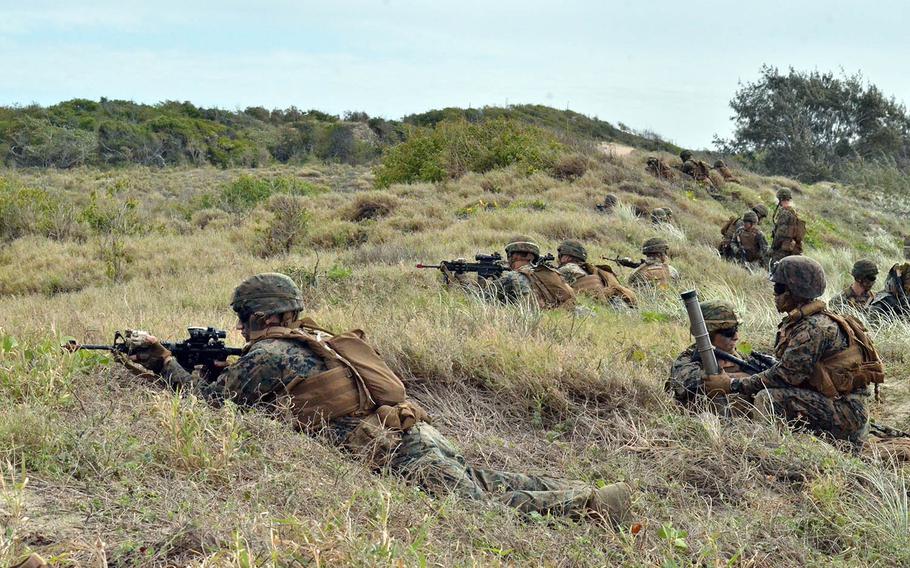 U.S. Marines secure a beach landing zone near Bowen, Australia, during the large-scale Talisman Sabre exercise in July 2019. Australia will invest $582 million to improve bases and training areas in its Northern Territory that are used by a rotational force of U.S. Marines, the country’s Defence Department announced Wednesday.