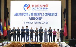 Chinese Foreign Minister Wang Yi, 6th from left, poses for group photos with ASEAN ministers and delegates during the ASEAN Post Ministerial Conference with China at the Association of Southeast Asian Nations (ASEAN) Foreign Ministers' Meeting in Vientiane, Laos, Friday, July, 26, 2024.