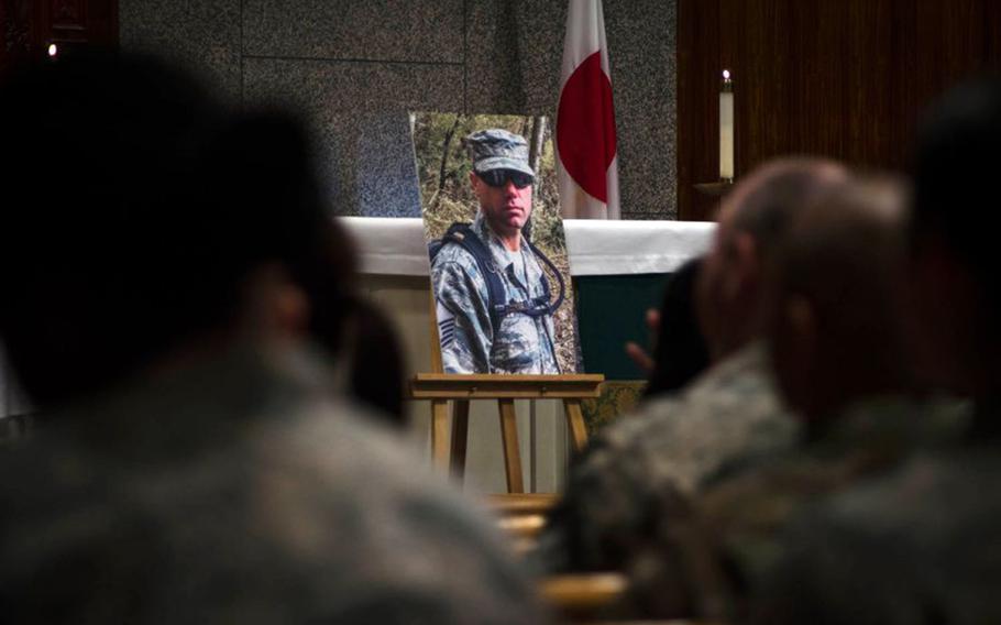 Servicemembers attend a memorial ceremony for Master Sgt. Nicholas Vollweiler at Yokota Air Base, Japan, Friday, Nov. 16, 2018.