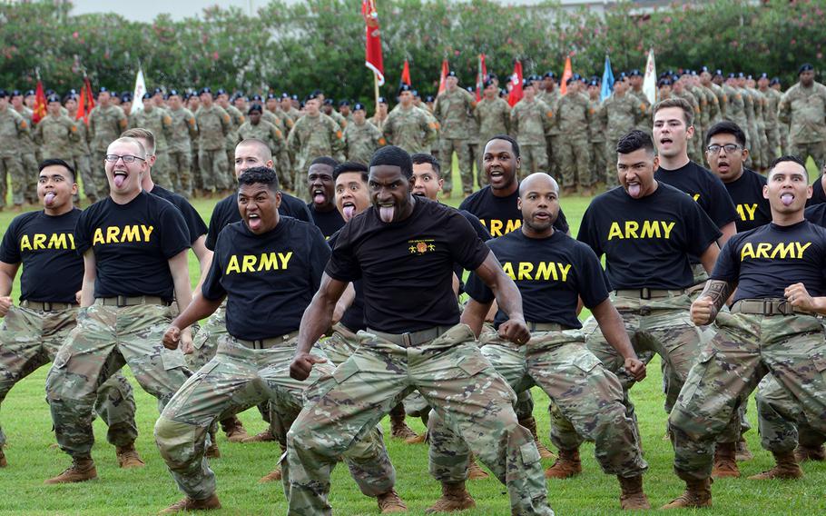 Soldiers perform a traditional Hawaiian warrior dance, hui ha'a koa, during a change-of-command ceremony at Schofield Barracks, Hawaii, Tuesday, Nov. 5, 2019.