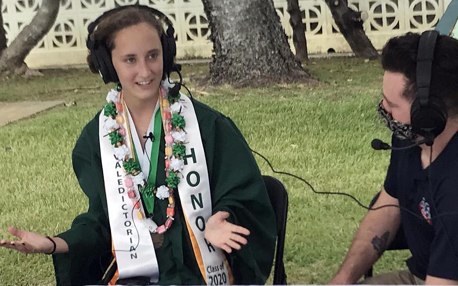 Kubasaki High School valedictorian Cameron Murray talks with AFN radio about the school's drive-thru graduation ceremony at Camp Foster, Okinawa, Saturday, June 6, 2020.