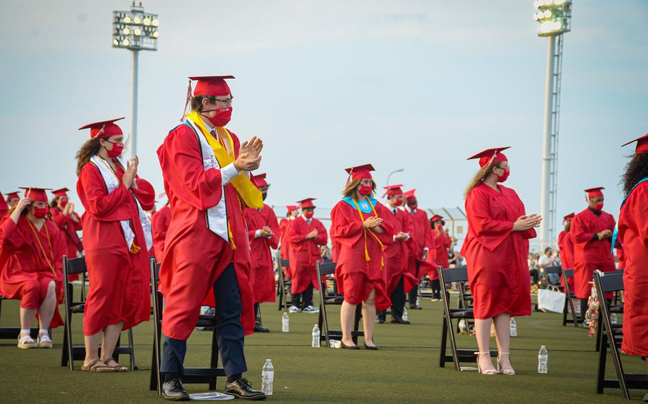 Seniors from Nile C. Kinnick High School attend their graduation ceremony on Berkey Field at Yokosuka Naval Base, Japan, Friday, June 5, 2020.