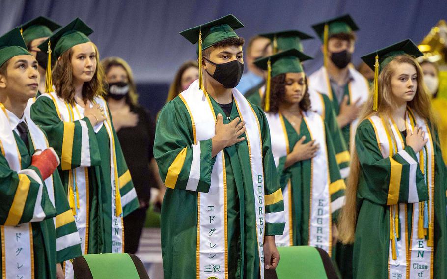 Seniors from Robert D. Edgren Middle High School stand for the U.S. and Japanese national anthems during their commencement ceremony at Misawa Air Base, Japan, Friday, June 5, 2020.