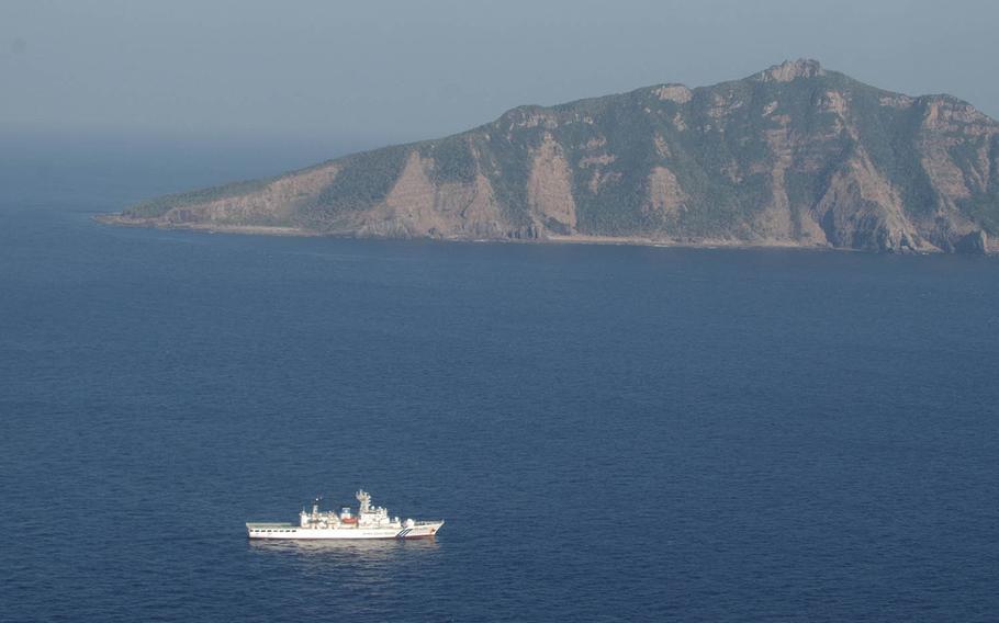 A Japan Coast Guard vessel sails in the East China Sea near Uotsuri Island, part of the Senkaku chain, in this undated photo. The Senkakus are controlled by Japan but also claimed by China and Taiwan.