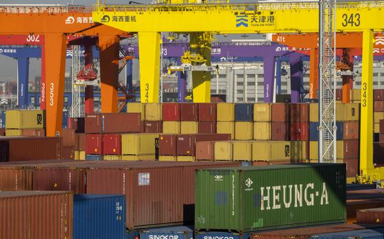 Shipping containers stacked at a port.