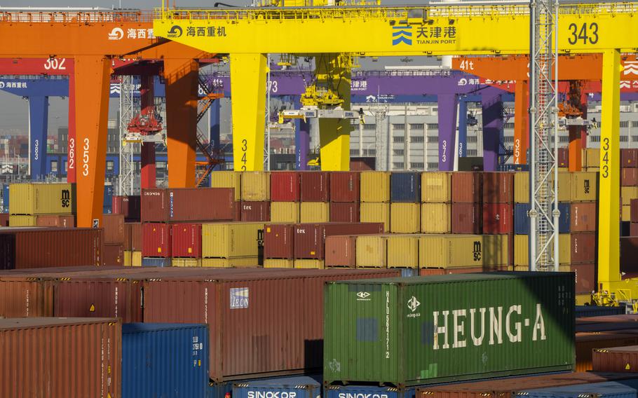 Shipping containers stacked at a port.