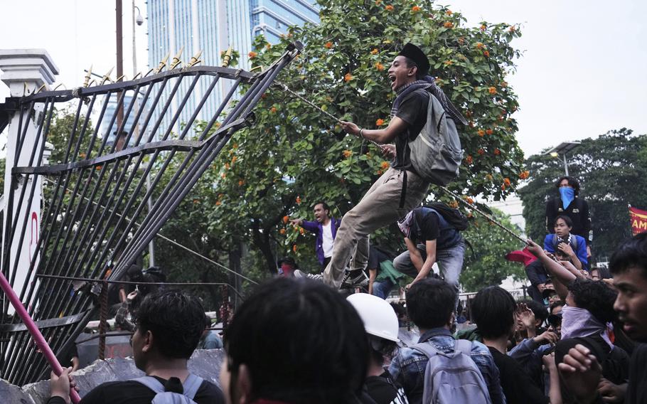 People riot outside a government building in Jakarta, Indonesia