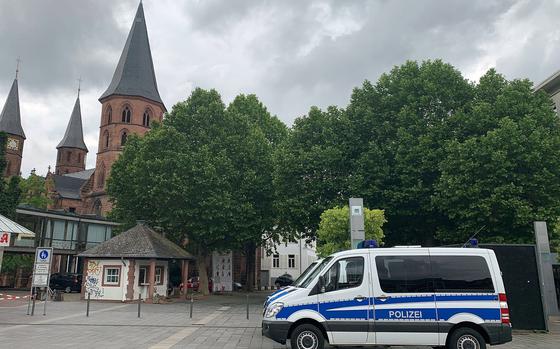 A pair of German police vans are parked in the Stiftsplatz in Kaiserslautern, Germany, in June 2020, ahead of a scheduled demonstration against racism. The U.S. military is warning Americans to stay away from a planned protest in Kaiserslautern on Saturday, Nov.21, against the German government’s coronavirus lockdown measures that has the potential to turn violent. Hundreds of police are expected to be on scene.

