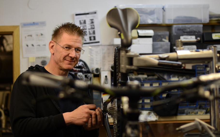 Heiko Bomersbach, a bike mechanic and salesman at The-B-Site bicycle shop in Baumholder, Germany, says he hopes the Americans stay. He says the city would not be the same without them.