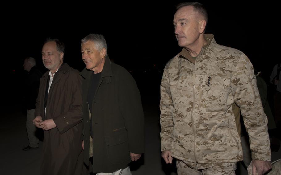 Secretary of Defense, Chuck Hagel, greets U.S. Ambassador to Afghanistan, James Cunningham, and Marine Corps General Joseph Dunford, Commander, International Security Force, upon his arrival in Kabul on March 8, 2013. 