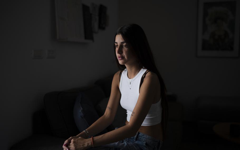 Ziv Abud talks about the Hamas attack on Oct. 7, 2023, at the Nova music festival during an interview at her house in Tel Aviv, Israel, Thursday, Sept. 19, 2024. Abud survived, protected by the crush of bodies above her, in a roadside bomb shelter near the Kibbutz Reim. Her boyfriend, Eliya Cohen, was taken captive. 