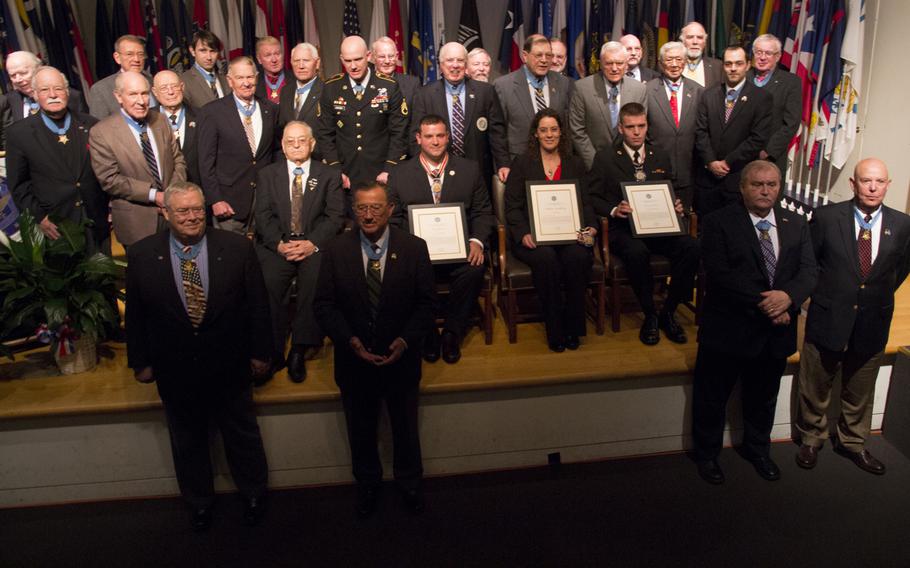 Citizen Honors award recipients pose with Medal of Honor recipients after a ceremony at Arlington National Cemetery on Medal of Honor Day, March 25, 2014.