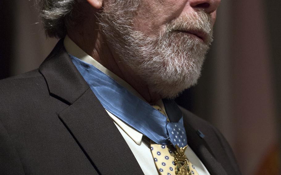 Medal of Honor recipient Drew Dix reads the citations during the Citizen Honors award ceremony at Arlington National Cemetery on Medal of Honor Day, March 25, 2014.