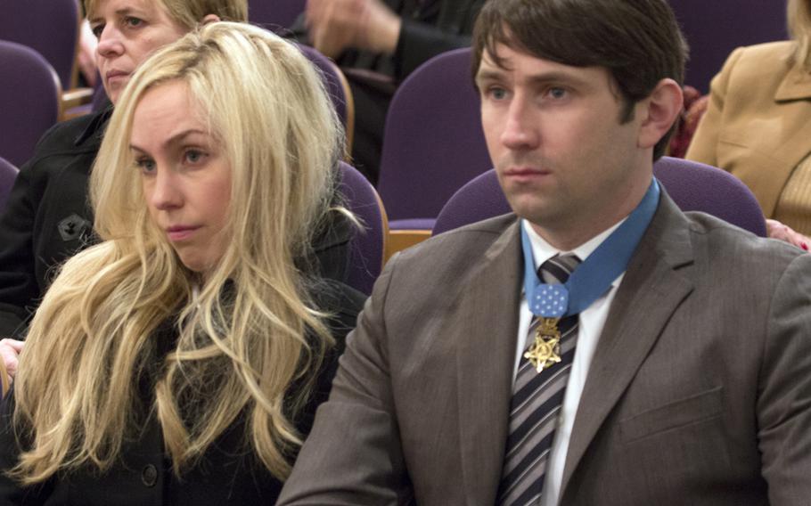 Medal of Honor recipient William Swenson and Kelsey Long listen to the Citizen Honors award ceremony at Arlington National Cemetery on Medal of Honor Day, March 25, 2014.