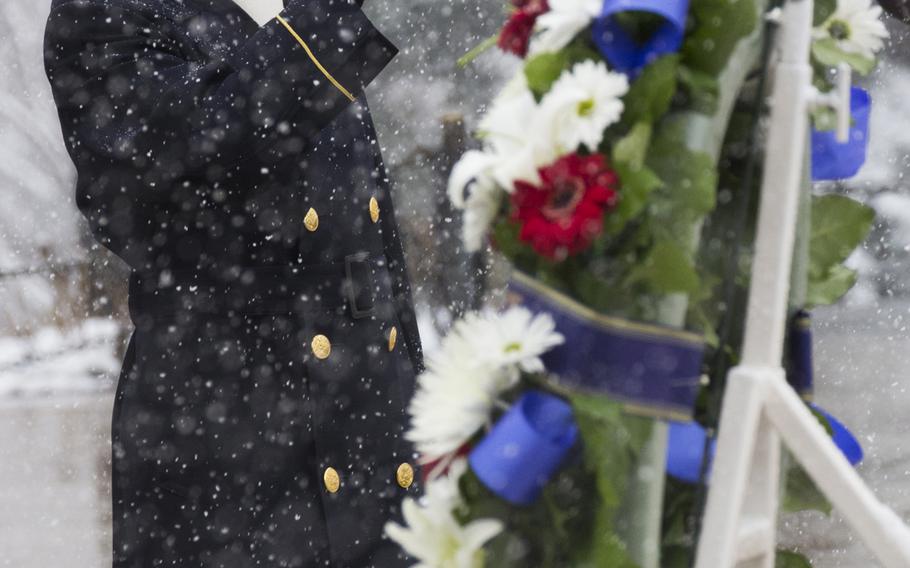 The bugler plays taps during the wreath-laying ceremony at Arlington National Cemetery on Medal of Honor Day, March 25, 2014.