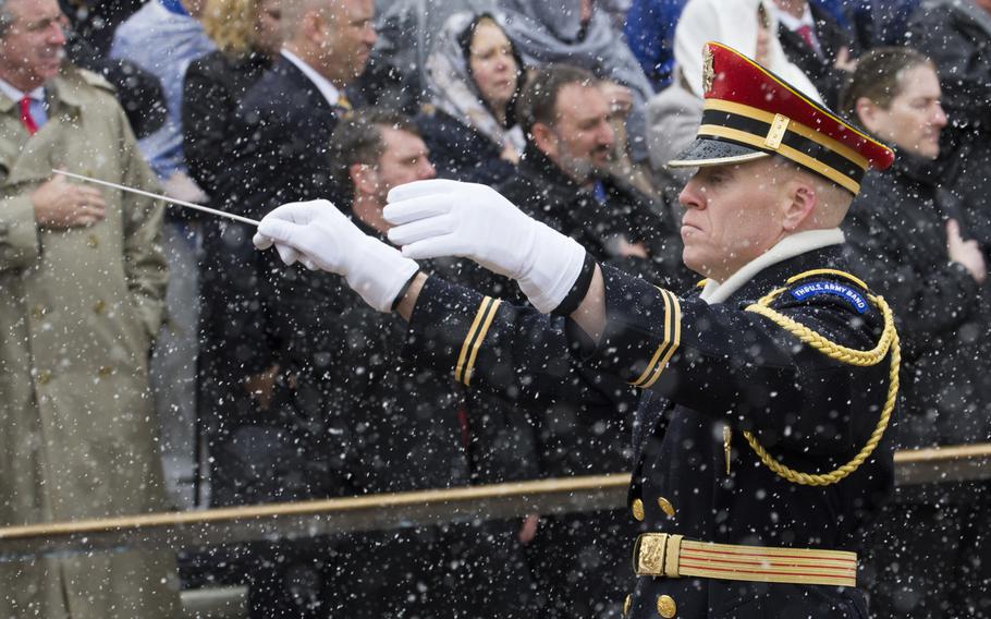 The U.S. Army Band takes part in a wreath-laying ceremony at Arlington National Cemetery on Medal of Honor Day, March 25, 2014.