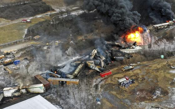 In this photo taken with a drone, portions of a Norfolk Southern freight train that derailed the previous night in East Palestine, Ohio, remain on fire at mid-day, Feb. 4, 2023. 