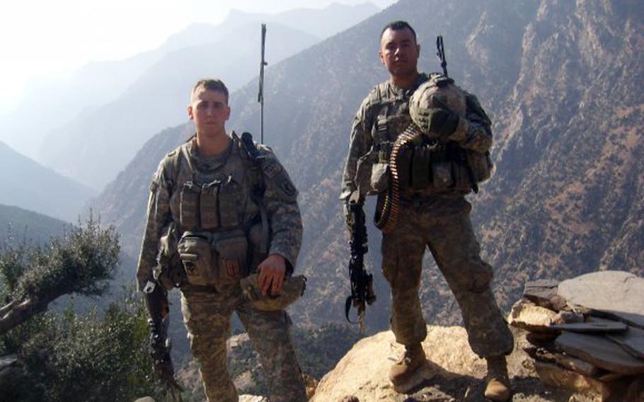 Sgt. Ryan Pitts, left, and Sgt. Israel Garcia patrol the mountains of eastern Afghanistan. Garcia was among 9 soldiers killed in the Battle of Wanat, July 13, 2008.