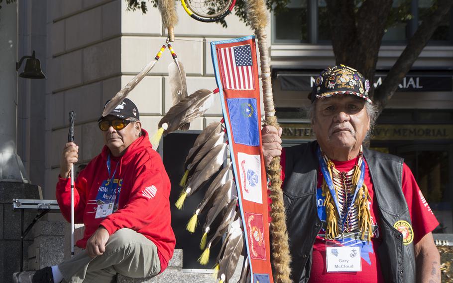 Gary McCloud, right, a retired Marine corporal, relaxes at the U.S. Navy Memorial on Veterans Day in Washington. In the background is Ed Dick. Both men were part of the first all Native American Honor Flight out of Nevada on Nov. 10.