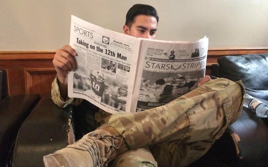 A soldier at Bagram Airfield reads Stars and Stripes while deployed to Afghanistan Sept. 19, 2019.