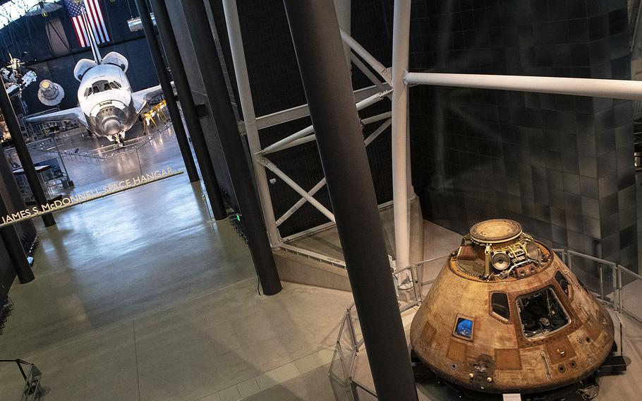 Space shuttle Discovery and the Apollo 11 command module, on display at the Smithsonian's Udvar-Hazy Center on March 3, 2020.