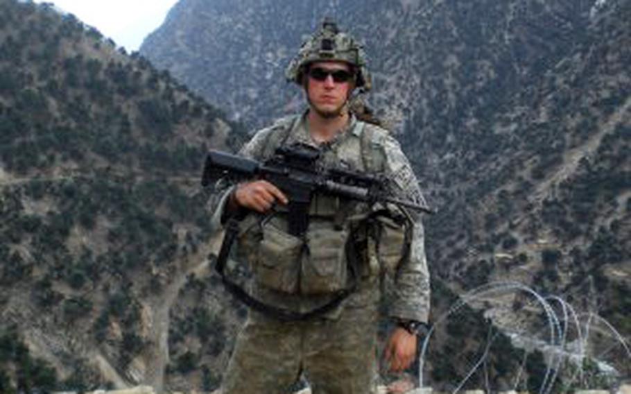 Sgt. Ryan Pitts, with Chosen Company, takes a break from building a traffic control point northeast of Combat Outpost Bella, Afghanistan, in 2008. The traffic control point was on the road from COP Bella to Aranas, Afghanistan.