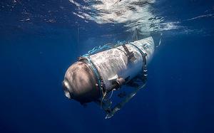 A small submarine enters the ocean.