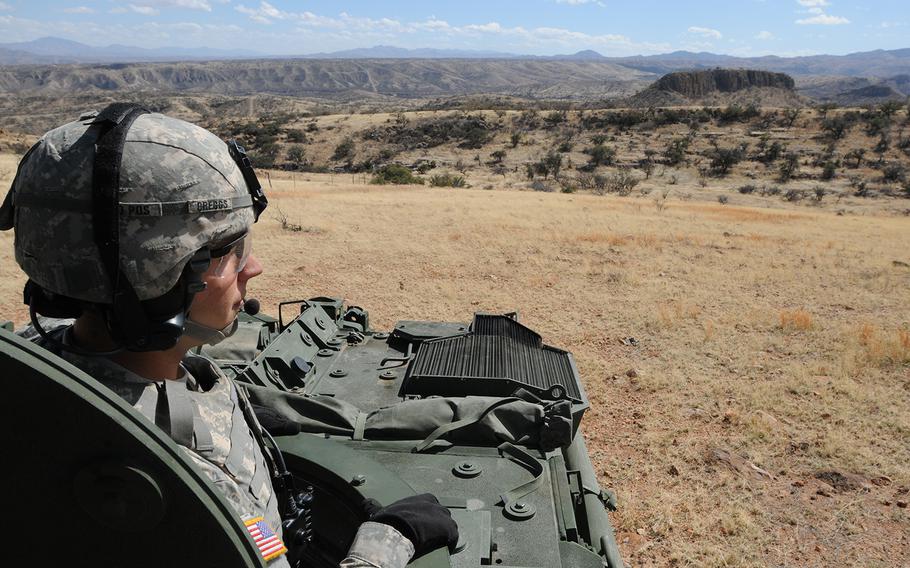 A soldier from the 1st Armored Division, Fort Bliss, Texas, conducts observations along the international border near Nogales, Ariz., Feb. 27, 2019.