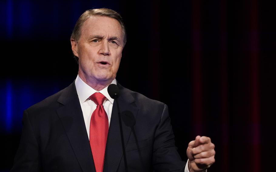 Former Sen. David Perdue speaks during a debate.