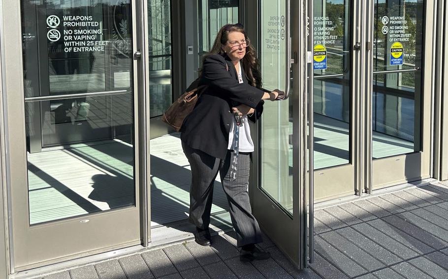 Heather Honey, a conservative election researcher, leaves the federal courthouse in Harrisburg, Pa., Friday, Oct. 18, 2024, after a judge heard argument regarding a request by her organization, PA Fair Elections, and six Republican members of Congress that he direct elections officials to take additional steps to verify the identity and eligibility of overseas voters, including those serving in the military and their families.