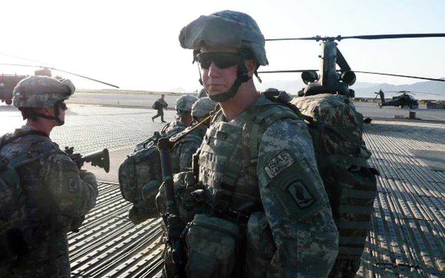 Sgt. Ryan Pitts waits for a flight at Bagram Airfield, Afghanistan.